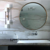 Modern Asymmetric Brass Wall Sconce with Cylindrical Glass Shades for Luxury Interiors