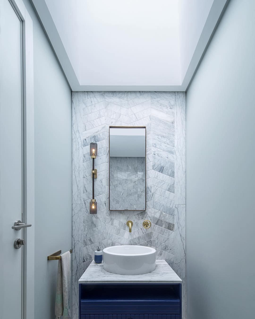 Modern Asymmetric Brass Wall Sconce with Cylindrical Glass Shades for Luxury Interiors