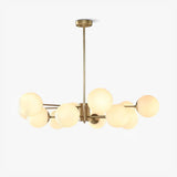 modern-asymmetrical-brass-chandelier-with-opal-glass-globe-shades-for-living-and-dining-rooms