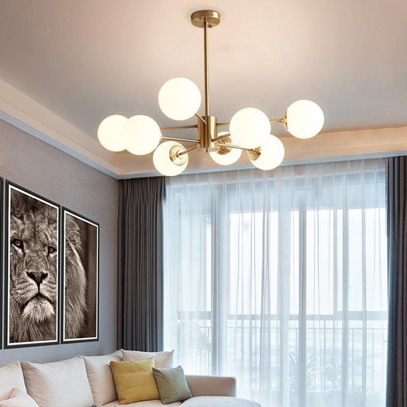 modern-asymmetrical-brass-chandelier-with-opal-glass-globe-shades-for-living-and-dining-rooms