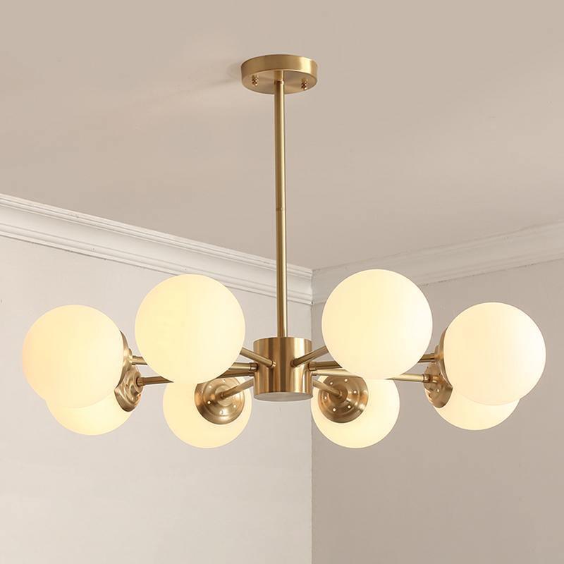 modern-asymmetrical-brass-chandelier-with-opal-glass-globe-shades-for-living-and-dining-rooms