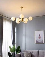 modern-asymmetrical-brass-chandelier-with-opal-glass-globe-shades-for-living-and-dining-rooms