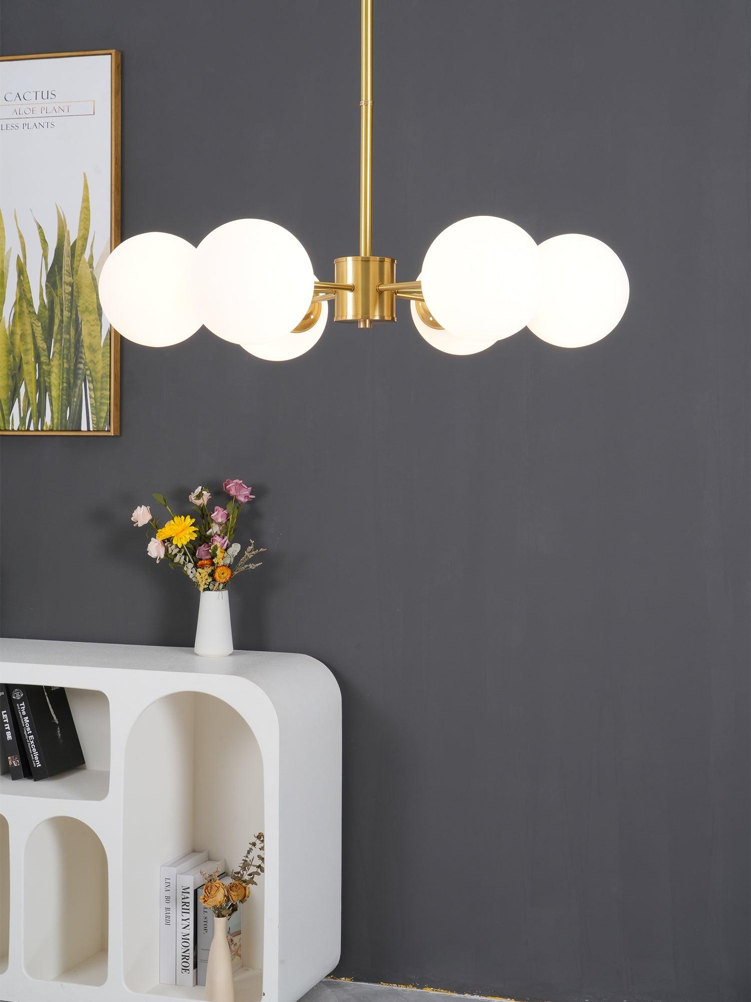modern-asymmetrical-brass-chandelier-with-opal-glass-globe-shades-for-living-and-dining-rooms