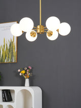 modern-asymmetrical-brass-chandelier-with-opal-glass-globe-shades-for-living-and-dining-rooms