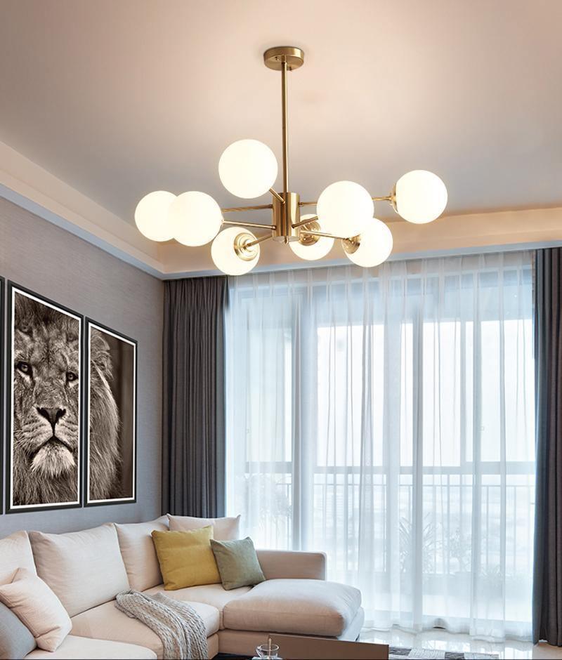 modern-asymmetrical-brass-chandelier-with-opal-glass-globe-shades-for-living-and-dining-rooms