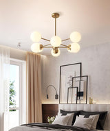 modern-asymmetrical-brass-chandelier-with-opal-glass-globe-shades-for-living-and-dining-rooms