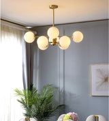 modern-asymmetrical-brass-chandelier-with-opal-glass-globe-shades-for-living-and-dining-rooms