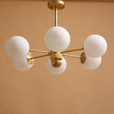 modern-asymmetrical-brass-chandelier-with-opal-glass-globe-shades-for-living-and-dining-rooms