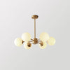 modern-asymmetrical-brass-chandelier-with-opal-glass-globe-shades-for-living-and-dining-rooms