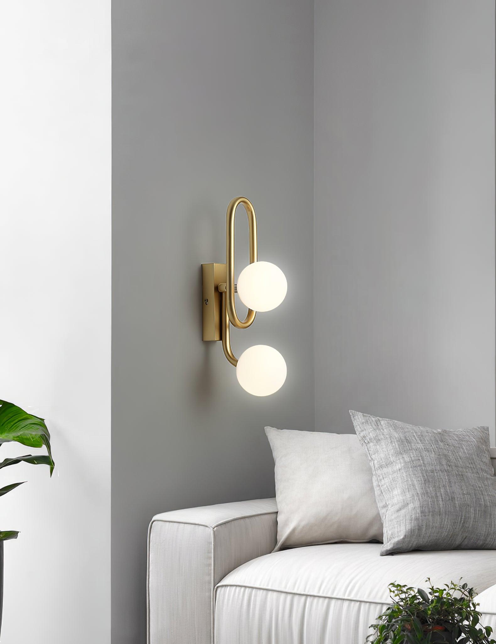 Modern Belisto Gold Wall Lamp with Oval Metal Frame and White Glass Globe Shade