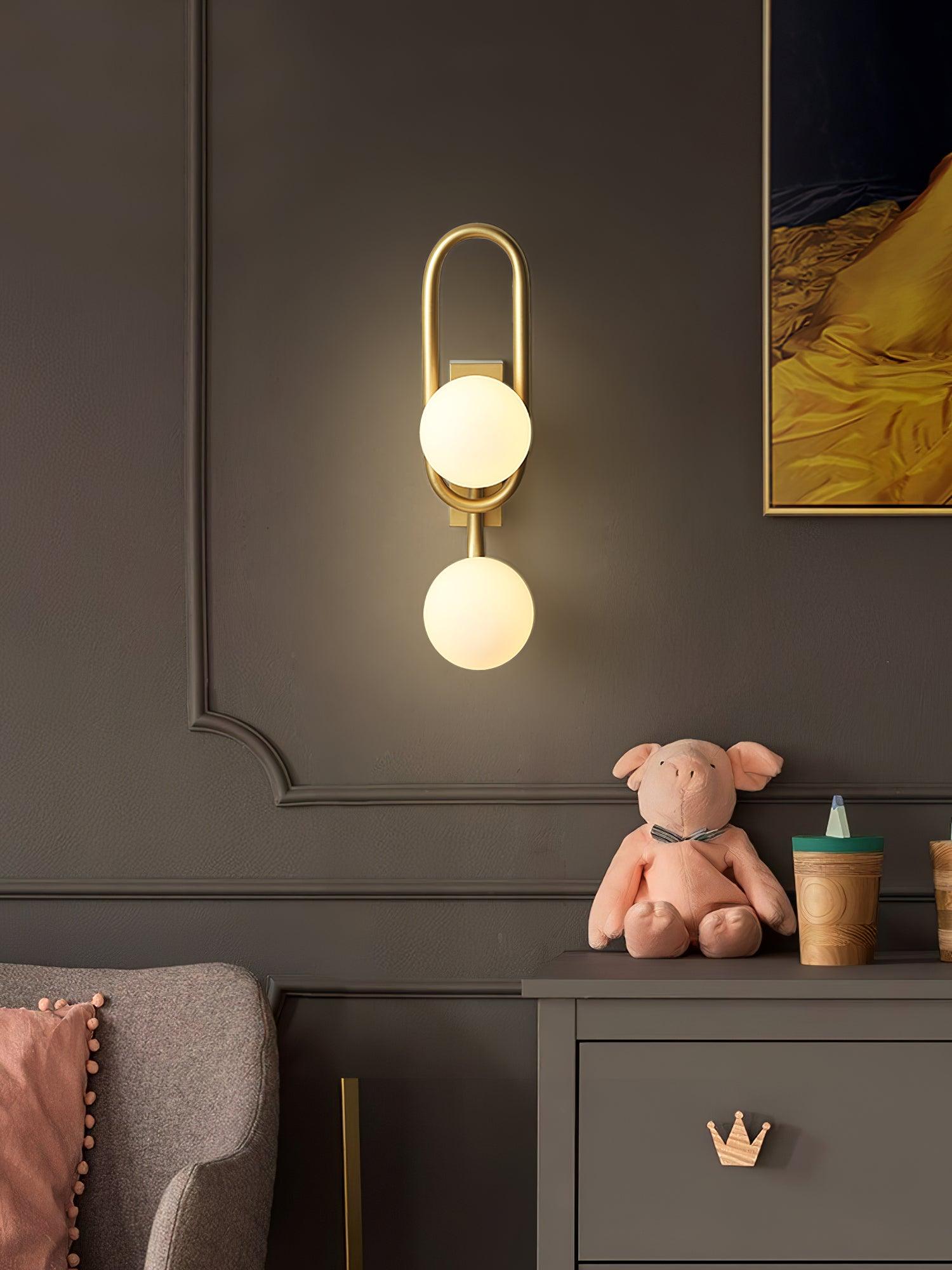 Modern Belisto Gold Wall Lamp with Oval Metal Frame and White Glass Globe Shade