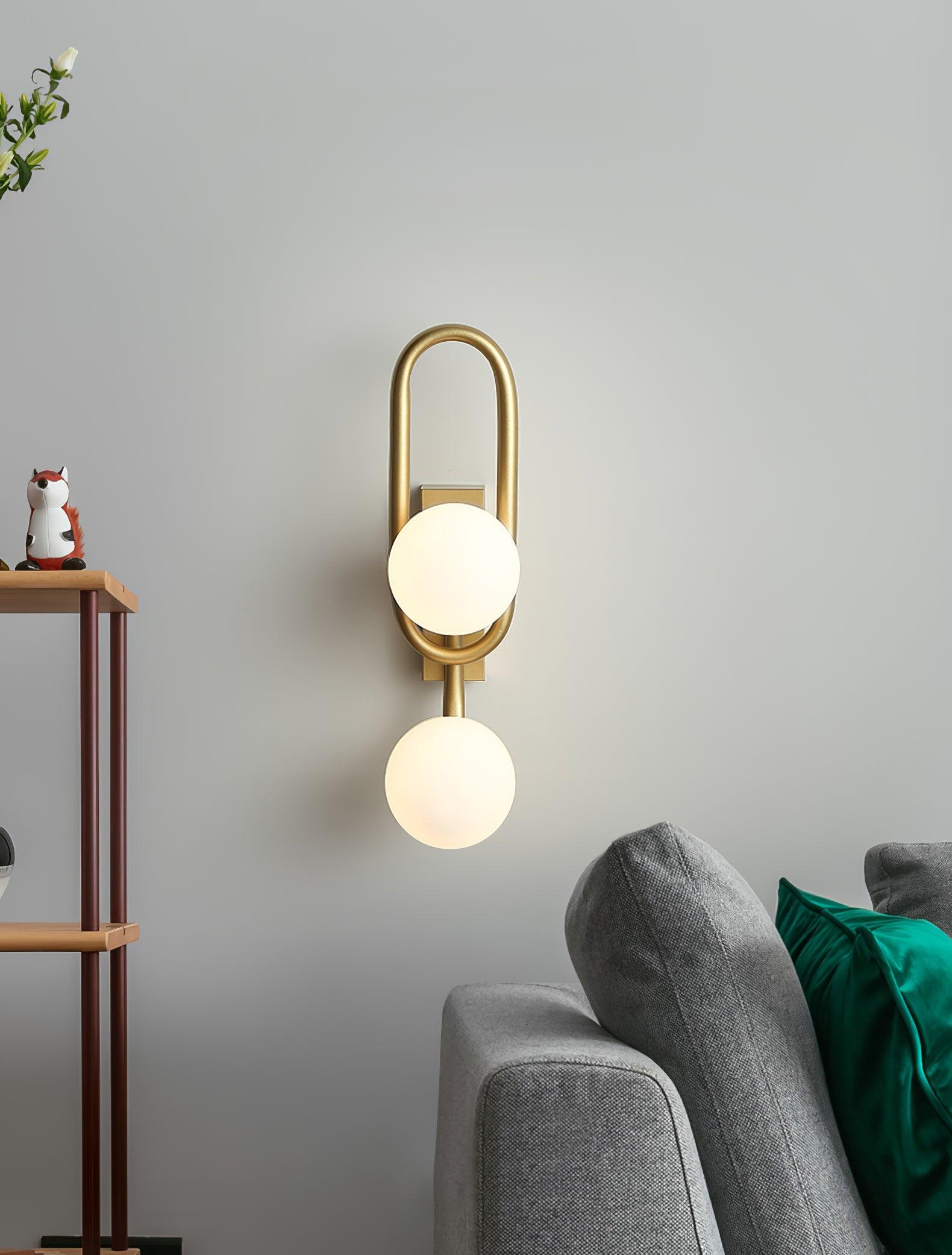 Modern Belisto Gold Wall Lamp with Oval Metal Frame and White Glass Globe Shade