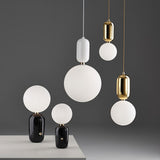 Modern Blown Glass Pendant Light with Minimalist Metal Frame for Contemporary Indoor Spaces