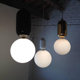 Modern Blown Glass Pendant Light with Minimalist Metal Frame for Contemporary Indoor Spaces