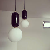 Modern Blown Glass Pendant Light with Minimalist Metal Frame for Contemporary Indoor Spaces