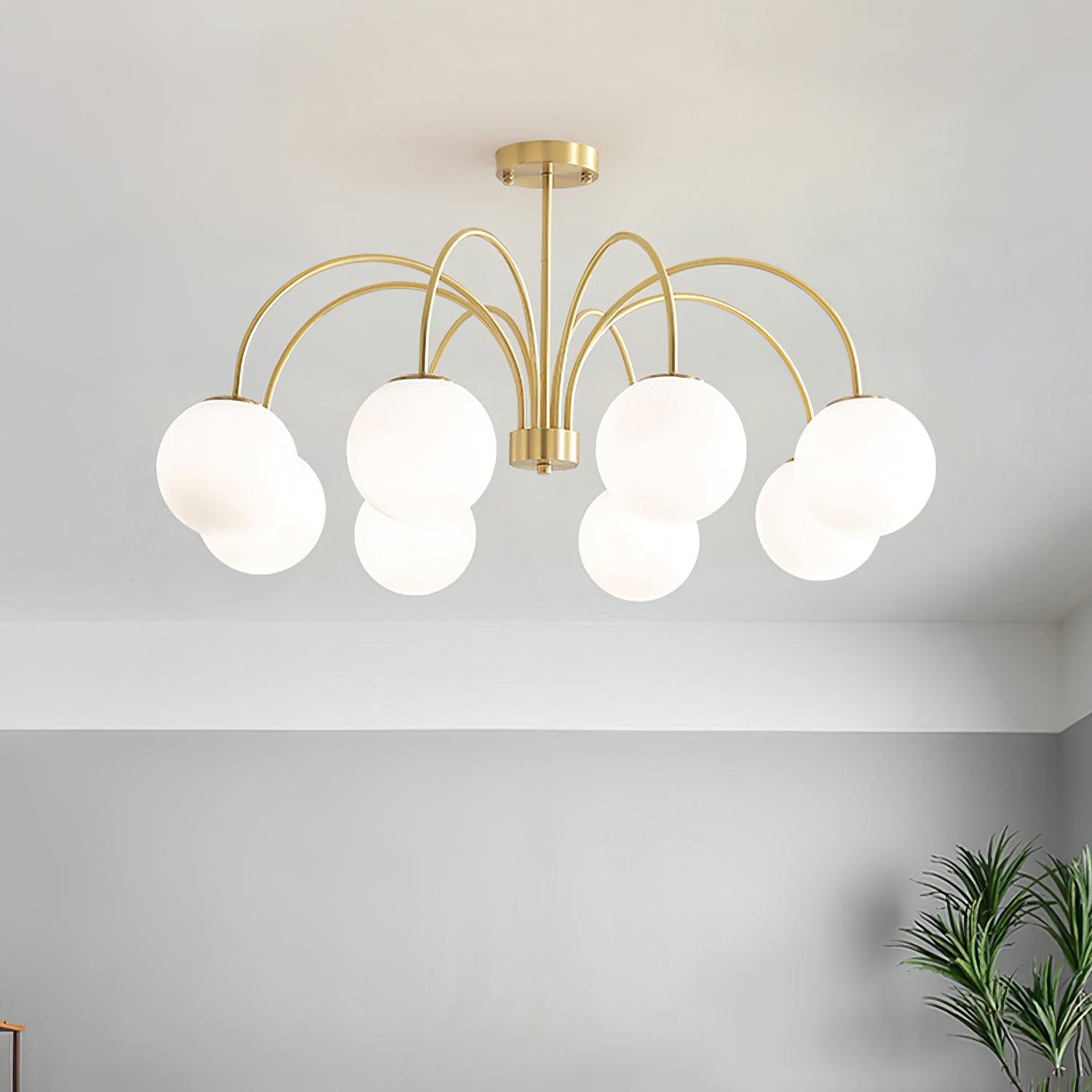 Modern Brass Globe Crown Chandelier with Elegant Curved Arms and Glass Ball Shades