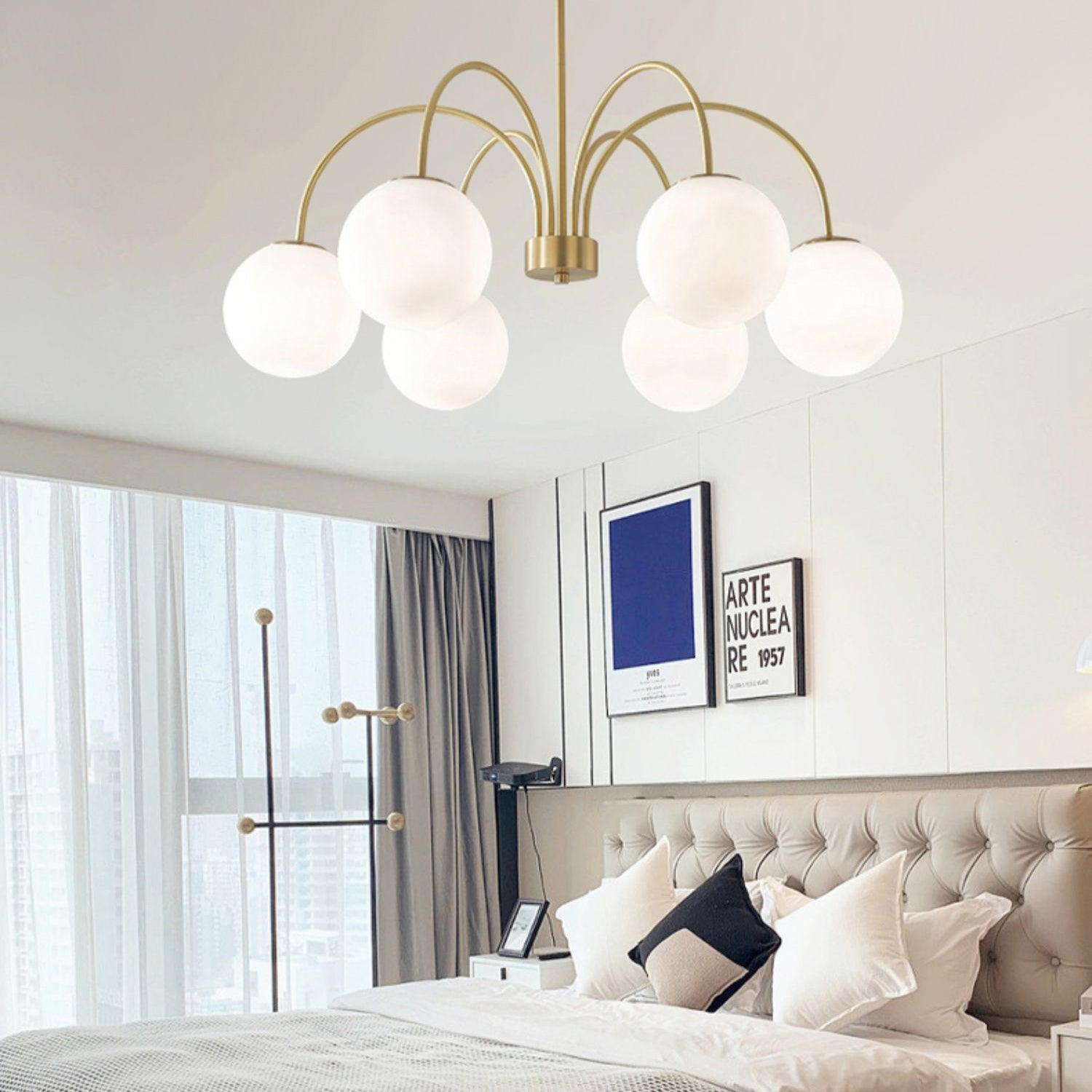 Modern Brass Globe Crown Chandelier with Elegant Curved Arms and Glass Ball Shades