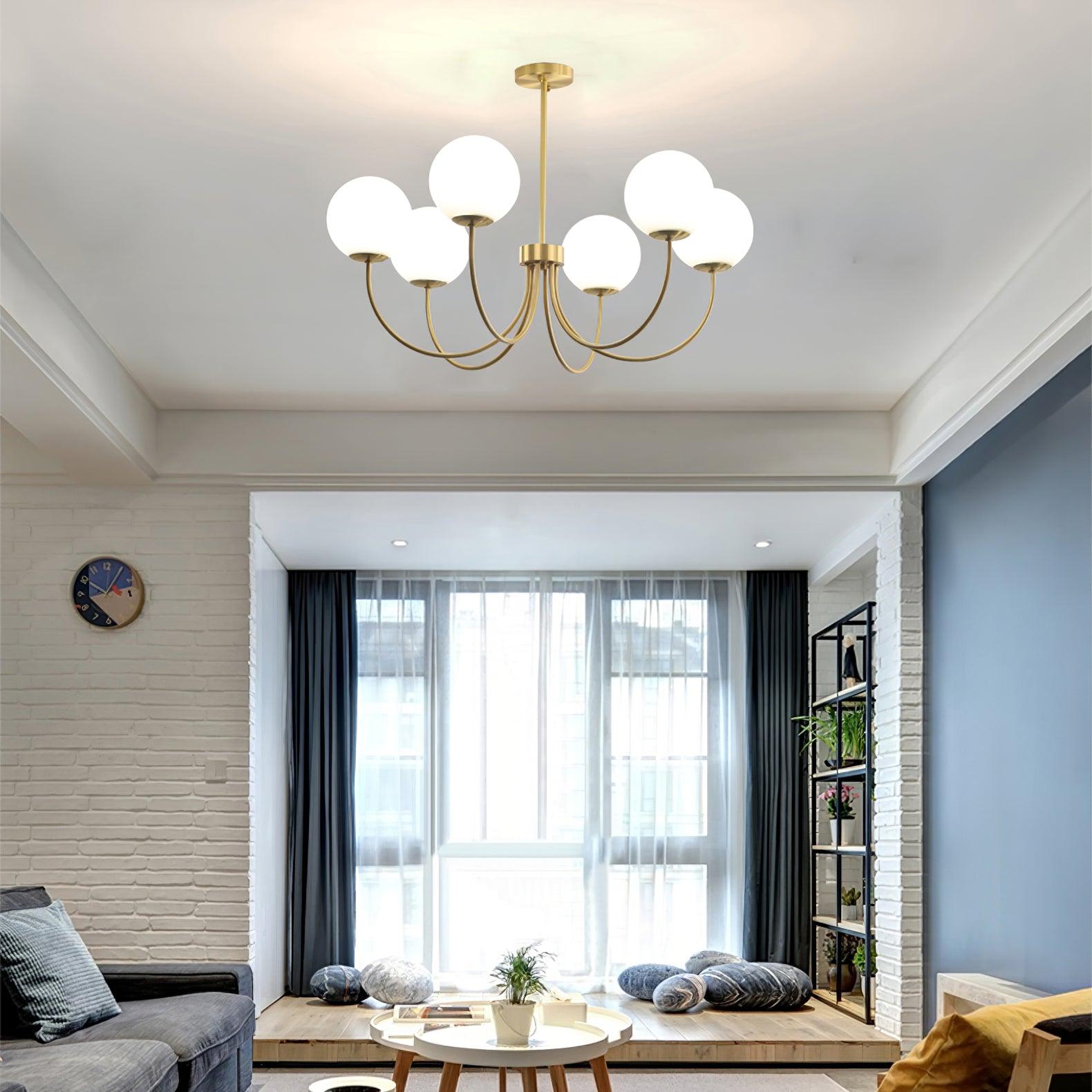 Modern Brass Globe Crown Chandelier with Elegant Curved Arms and Glass Ball Shades