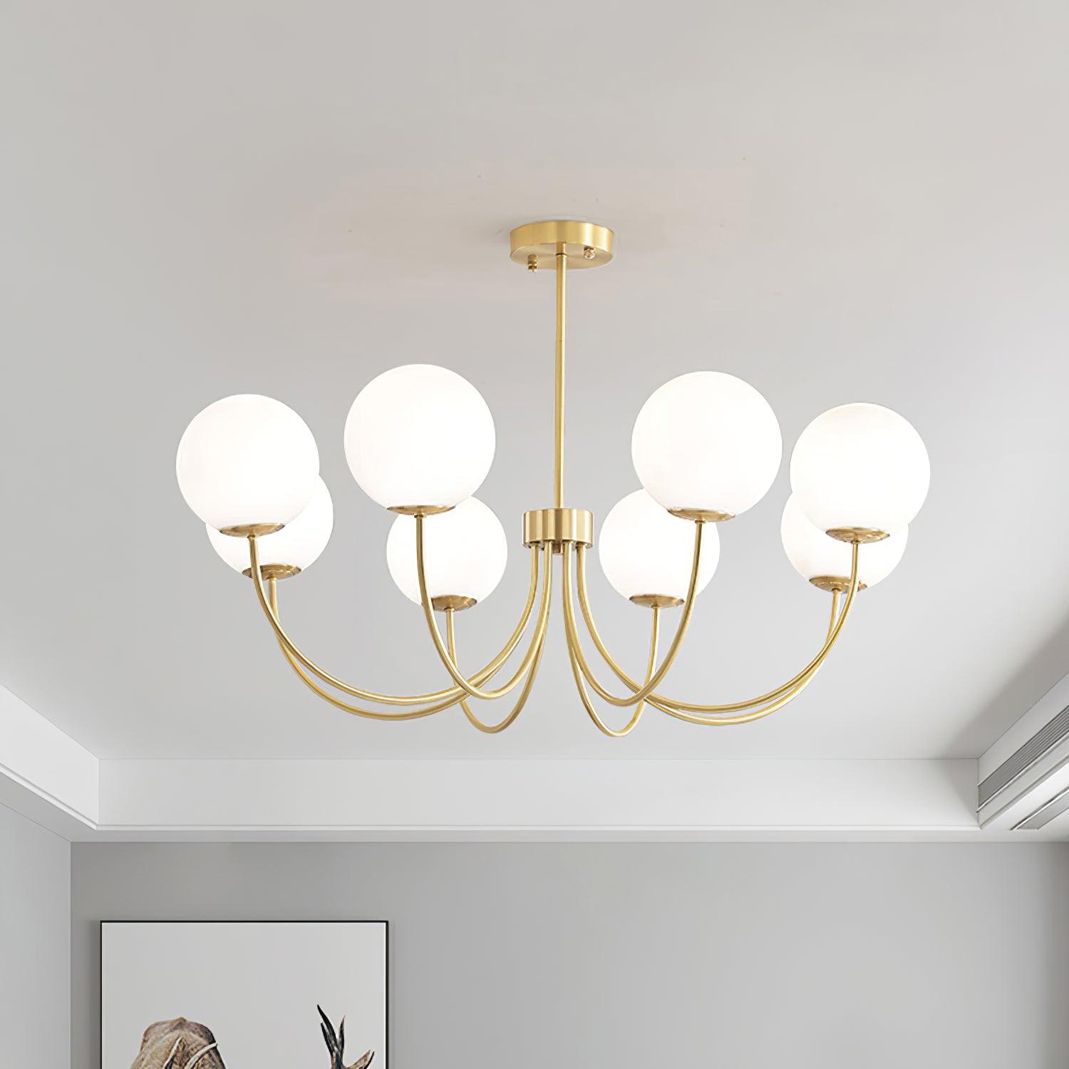 Modern Brass Globe Crown Chandelier with Elegant Curved Arms and Glass Ball Shades