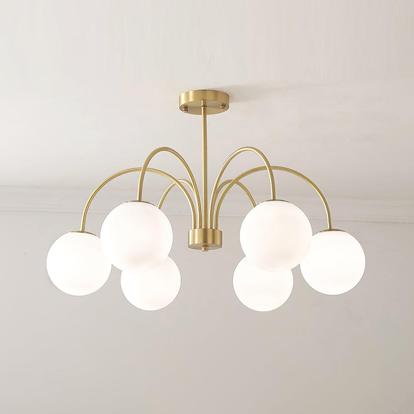 Modern Brass Globe Crown Chandelier with Elegant Curved Arms and Glass Ball Shades