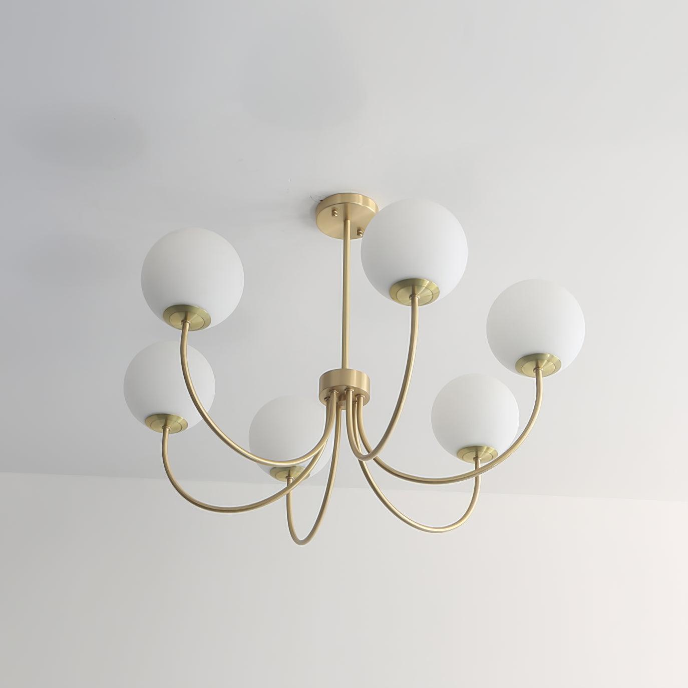 Modern Brass Globe Crown Chandelier with Elegant Curved Arms and Glass Ball Shades