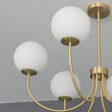 Modern Brass Globe Crown Chandelier with Elegant Curved Arms and Glass Ball Shades
