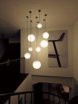 Modern Brass Rod Pendant Light with Spherical Mouth Blown Opal Glass Globe