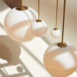 Modern Brass Rod Pendant Light with Spherical Mouth Blown Opal Glass Globe