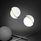 Modern Crescent Brass Pendant Light with Opal Globe Shade and Brushed Fascia