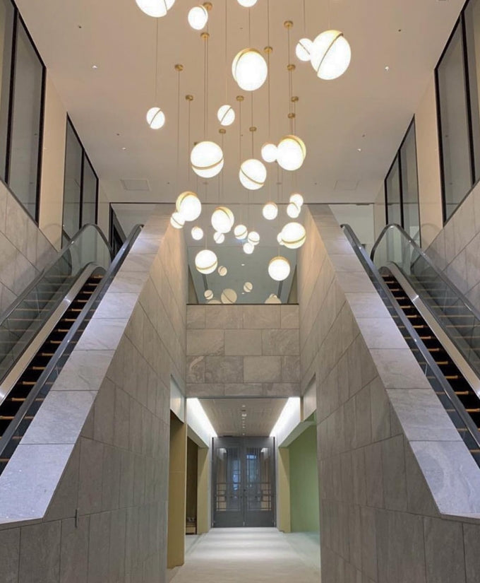 Modern Crescent Brass Pendant Light with Opal Globe Shade and Brushed Fascia
