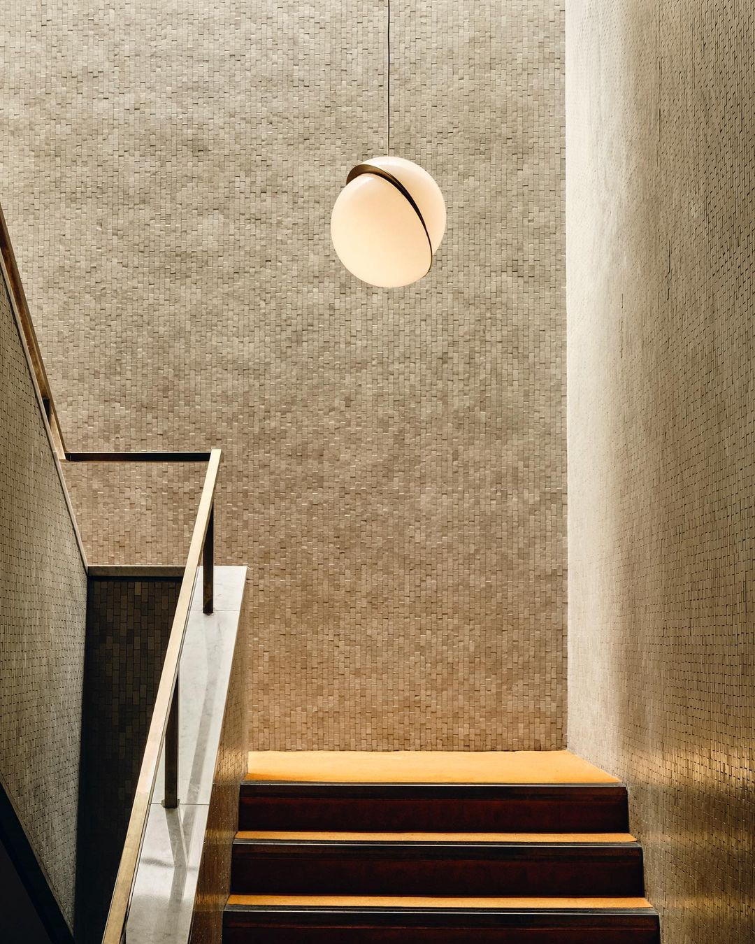 Modern Crescent Brass Pendant Light with Opal Globe Shade and Brushed Fascia