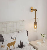 modern-cylinder-glass-wall-sconce-with-perforated-metal-cage-and-steel-accents-for-home-decor