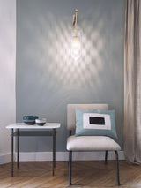 modern-cylinder-glass-wall-sconce-with-perforated-metal-cage-and-steel-accents-for-home-decor