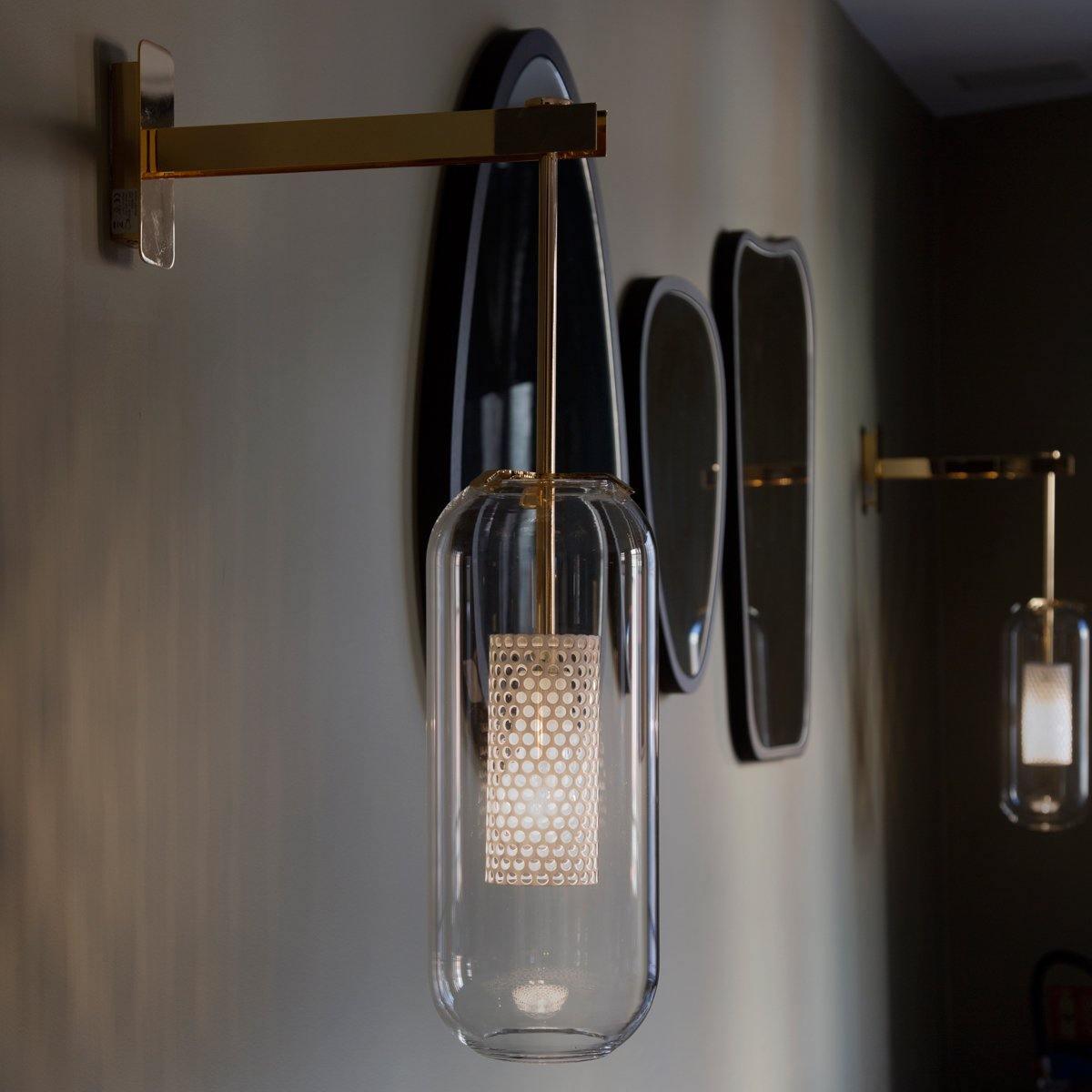 modern-cylinder-glass-wall-sconce-with-perforated-metal-cage-and-steel-accents-for-home-decor