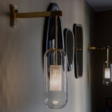 modern-cylinder-glass-wall-sconce-with-perforated-metal-cage-and-steel-accents-for-home-decor