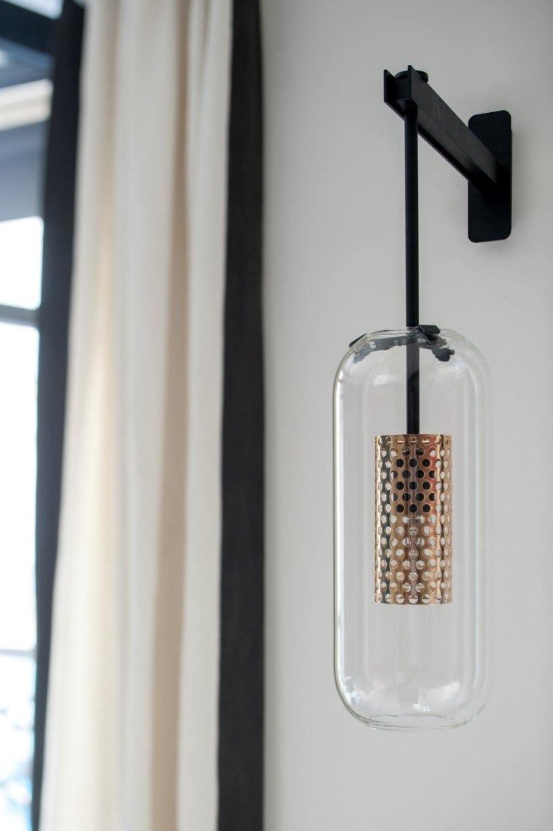 modern-cylinder-glass-wall-sconce-with-perforated-metal-cage-and-steel-accents-for-home-decor