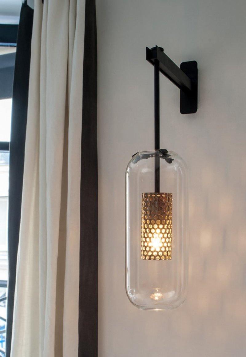 modern-cylinder-glass-wall-sconce-with-perforated-metal-cage-and-steel-accents-for-home-decor