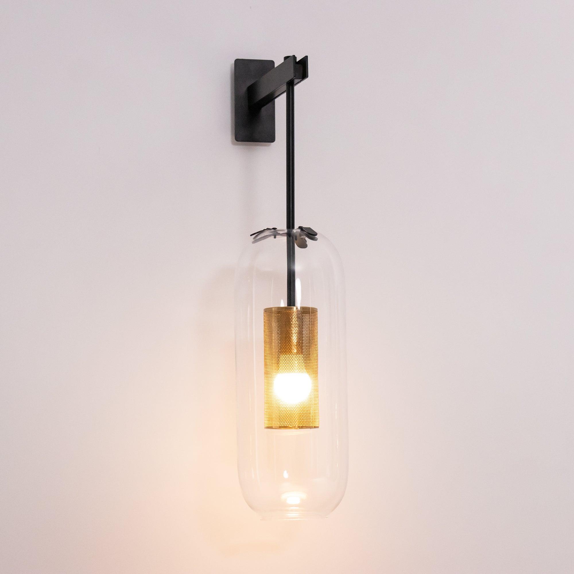modern-cylinder-glass-wall-sconce-with-perforated-metal-cage-and-steel-accents-for-home-decor