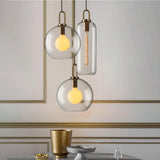 Modern Glass Capsule and Sphere Pendant Light with Copper Finish for Interior Decor