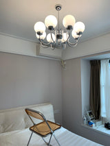 Modern Glass Globe Crown Chandelier with Elegant Chrome Curved Arms