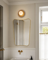 Modern Glass Globe Wall Sconce and Ceiling Lamp with Brass Metal Disc for Elegant Interior Decor