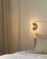 Modern Glass Globe Wall Sconce and Ceiling Lamp with Brass Metal Disc for Elegant Interior Decor