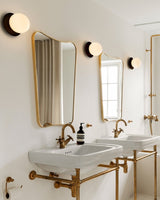 Modern Glass Globe Wall Sconce and Ceiling Lamp with Brass Metal Disc for Elegant Interior Decor