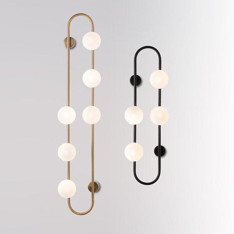 Modern Glass Globe Wall Sconce with Gold Metal Branch and Vertical Hanging Rod