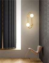 Modern Glass Globe Wall Sconce with Gold Metal Branch and Vertical Hanging Rod