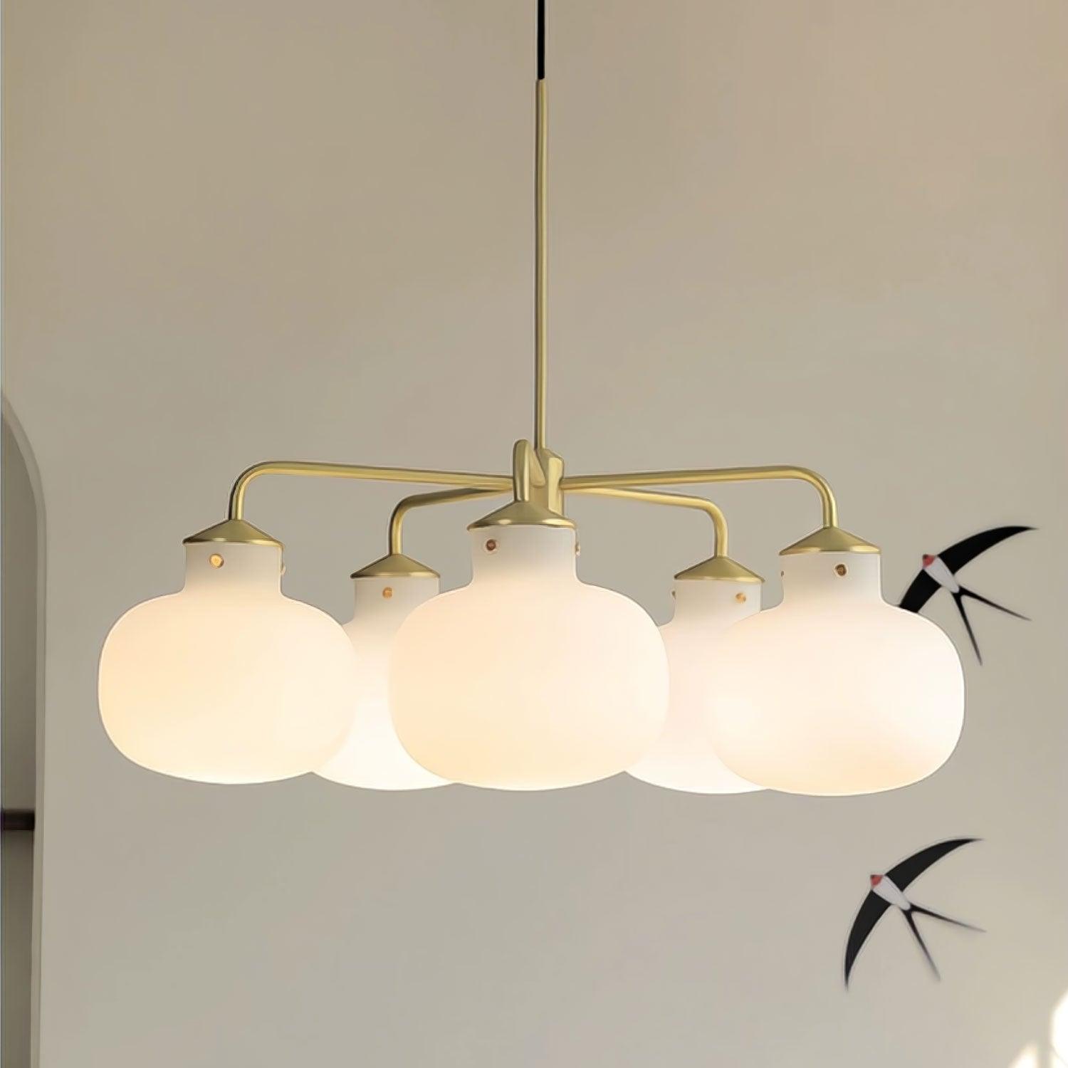 Modern Gold Metal and Opal Glass Globe Pendant Light for Contemporary Interiors