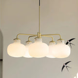Modern Gold Metal and Opal Glass Globe Pendant Light for Contemporary Interiors