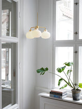 Modern Gold Metal and Opal Glass Globe Pendant Light for Contemporary Interiors