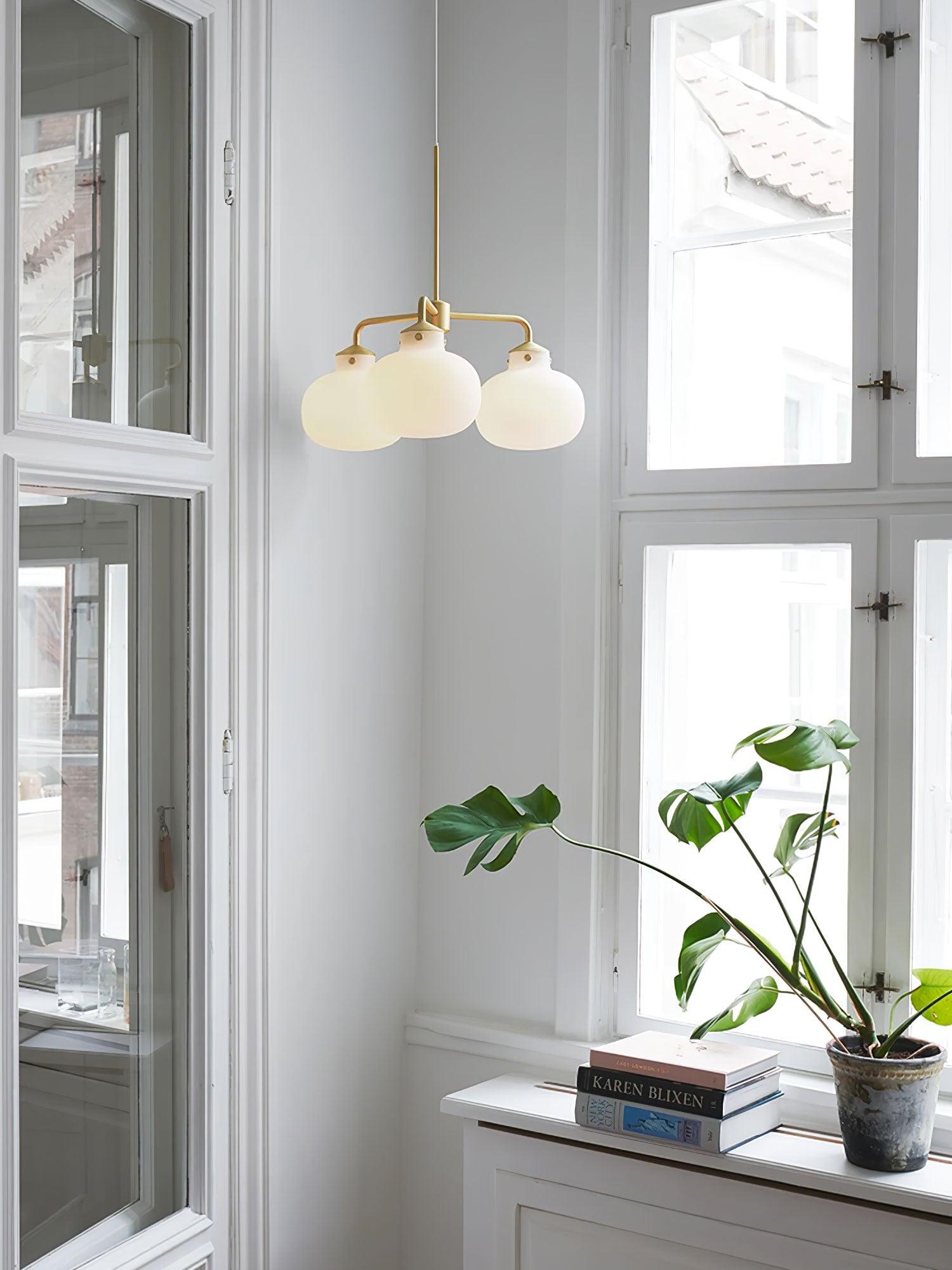 Modern Gold Metal and Opal Glass Globe Pendant Light for Contemporary Interiors