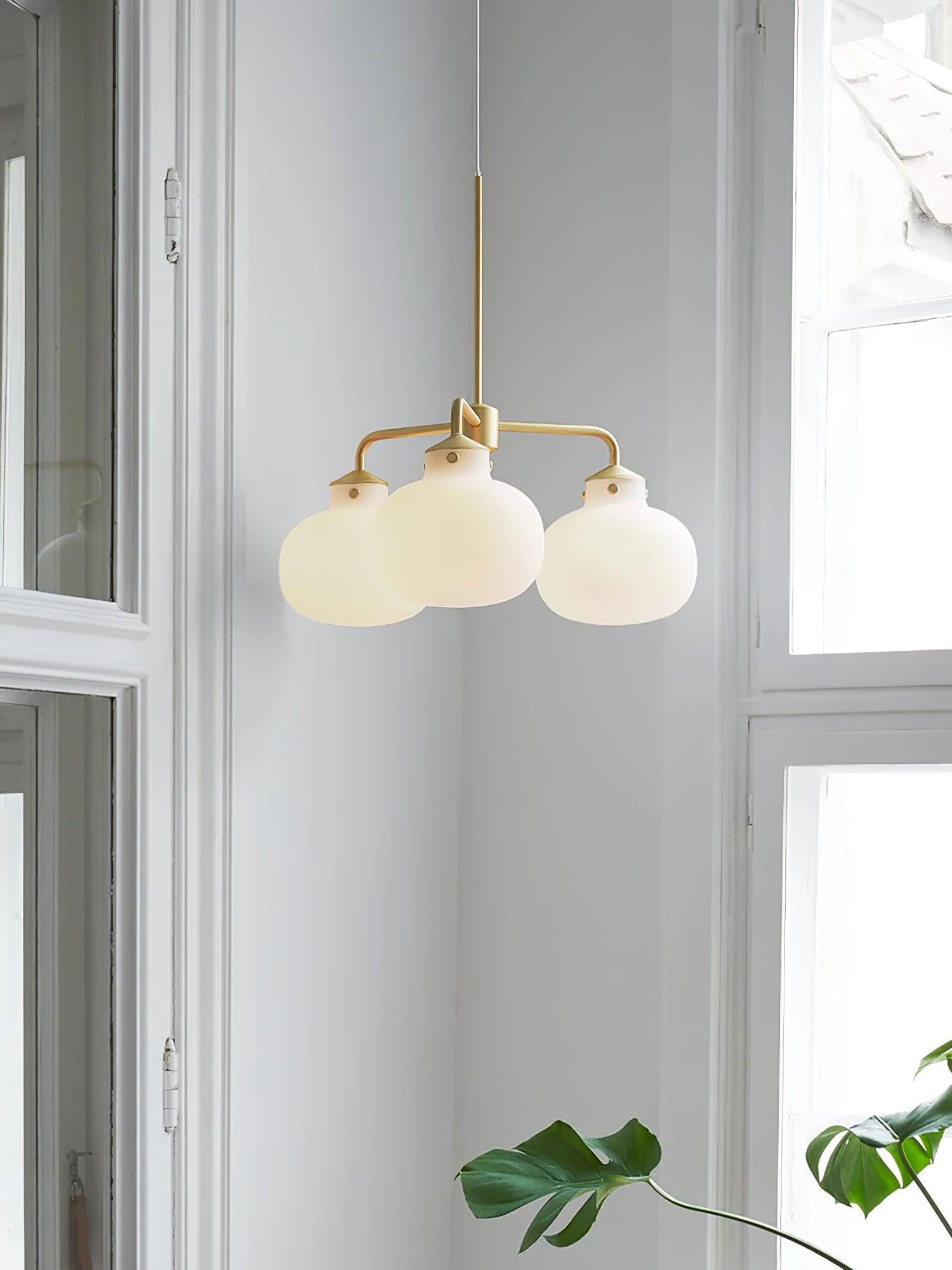 Modern Gold Metal and Opal Glass Globe Pendant Light for Contemporary Interiors